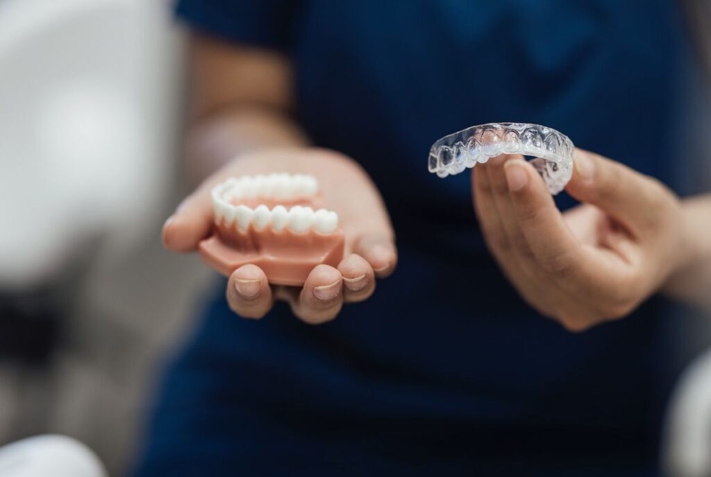 Patient wearing clear aligners for invisible teeth straightening