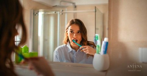 Person worried about bad breath even after brushing teeth